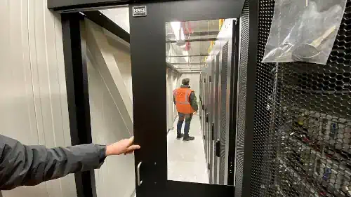 engineers in a data center built by power continuity
