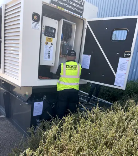 Power continuity engineer checking oil pressure