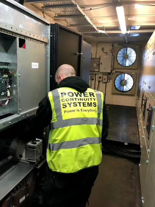 Power continuity engineer installing three phase ups