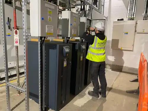 Power continuity engineer servicing a ups