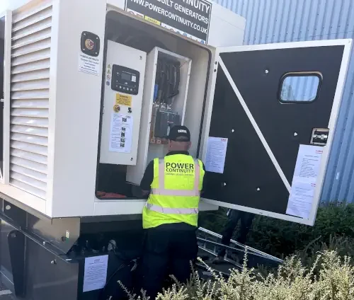 Power continuity engineer servicing diesel generator