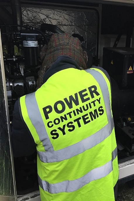 Power continuity engineer servicing generator