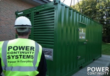 Power continuity engineer servicing green containerised generator