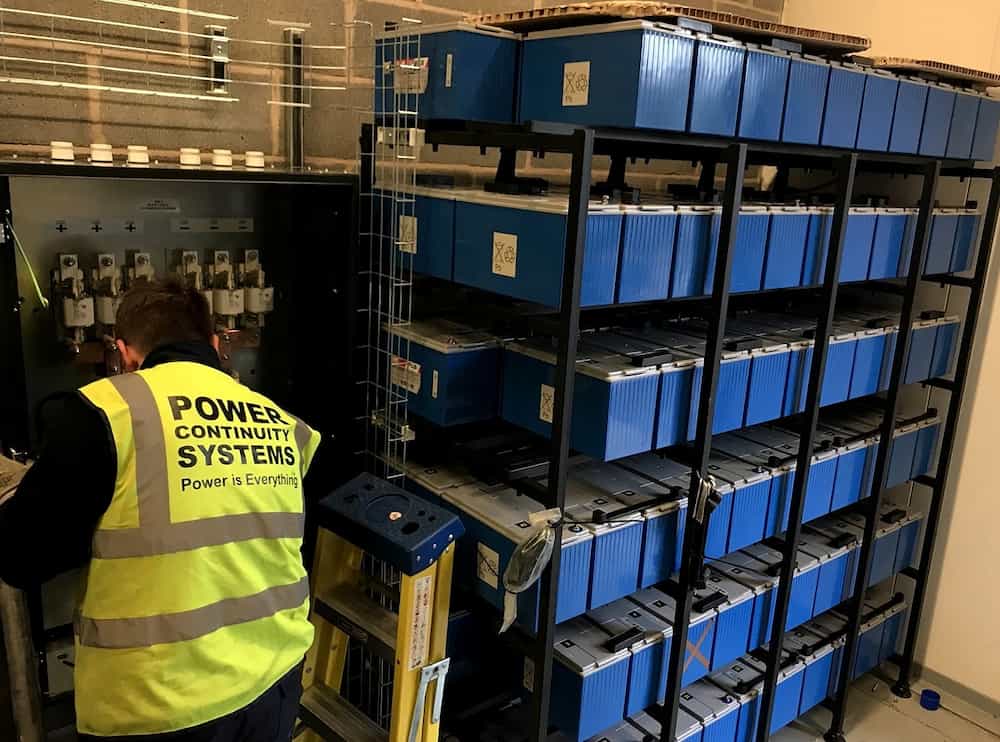 Power continuity engineer testing batteries