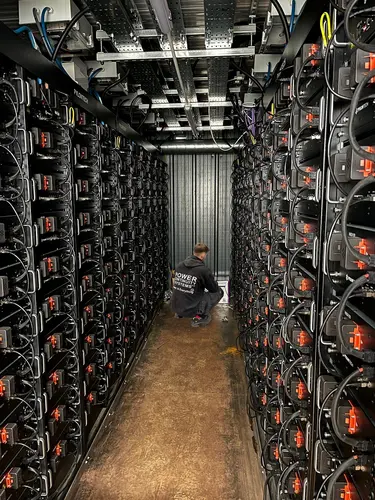 Power continuity engineer working inside a battery energy storage system