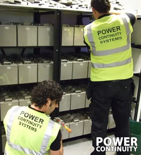 Power continuity engineers changing ups batteries