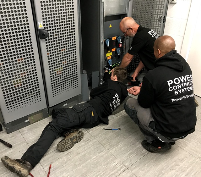 Power continuity engineers decommissioning a ups
