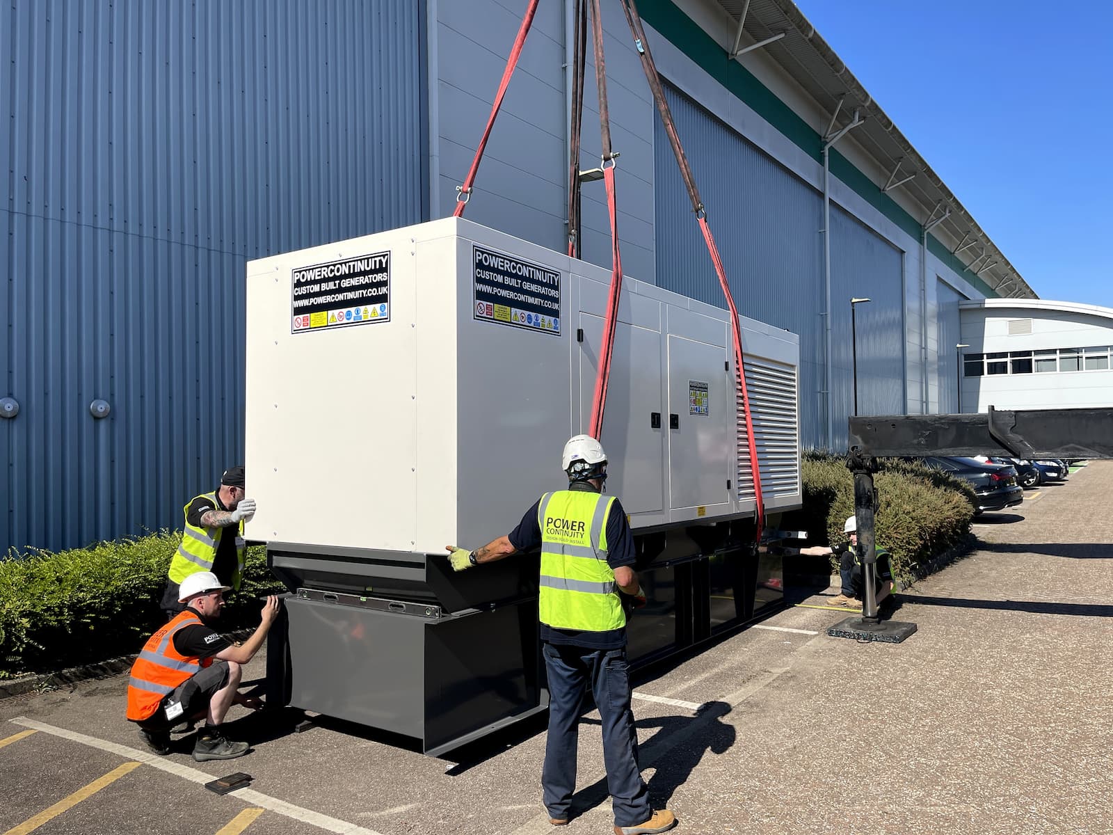 Power continuity engineers delivering generator on site