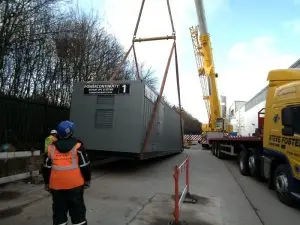 Power continuity rotary ups container lowered into position
