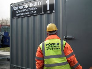 Power continuity rotary ups container with engineer standing outside