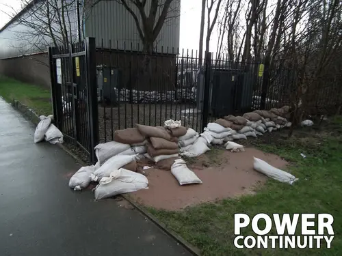 Power continuity sandbags in front of the substation