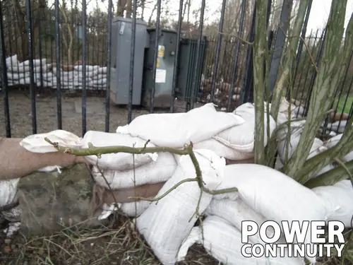 Power continuity sandbags in front of transformer