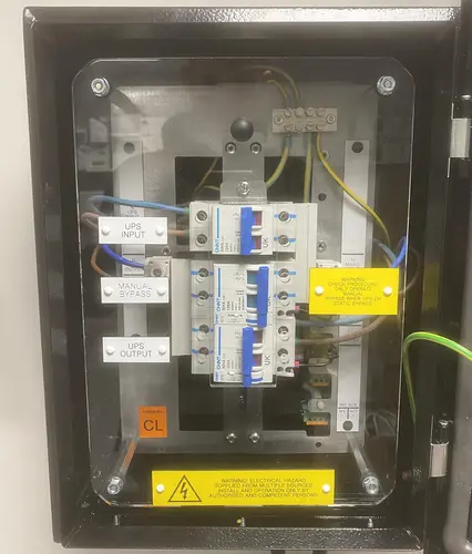 Power continuity wall mounted ups bypass switch
